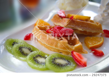 fruit waffle kiwi strawberry dessert on white dish fruit waffle kiwi strawberry dessert on white dish 29247373
