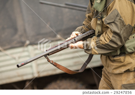 the hunter holds the gun. the hunter holds the gun. 29247856