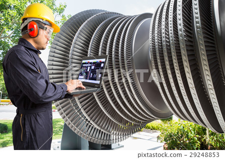 Engineer use computer maintenance steam turbine  29248853