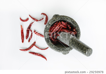 dried chili with mortar on white backgro 29250978