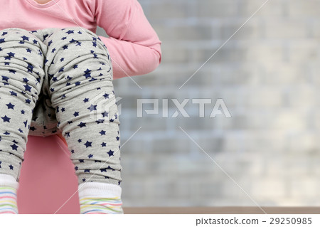 Children's legs hanging down from a chamber-pot Children's legs hanging down from a chamber-pot 29250985