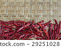 spicy chili on bamboo background 29251028