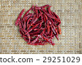 spicy chili on bamboo background 29251029