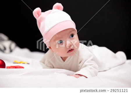 beautiful cute baby in hat near gifts  29251121