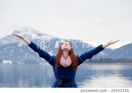 beautiful young woman on the mountains background beautiful young woman on the mountains background 29252528