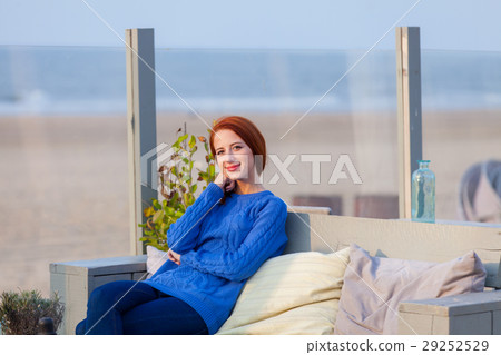 woman sitting in the cafe on the beach woman sitting in the cafe on the beach 29252529
