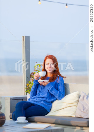 woman with cup of coffee sitting in the cafe woman with cup of coffee sitting in the cafe 29252530