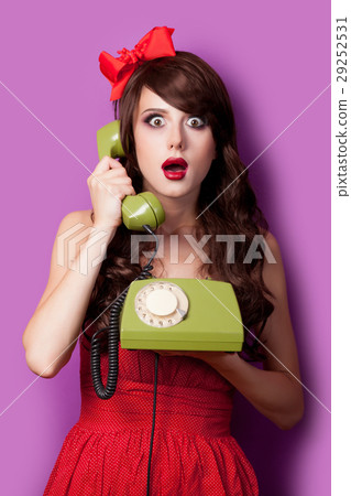 photo of beautiful young woman with retro phone 29252531