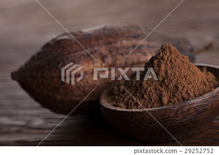 Cocoa beans in the dry cocoa pod fruit on wooden Cocoa beans in the dry cocoa pod fruit on wooden 29252752