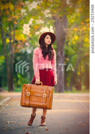 photo of beautiful young woman with suitcase photo of beautiful young woman with suitcase 29253406