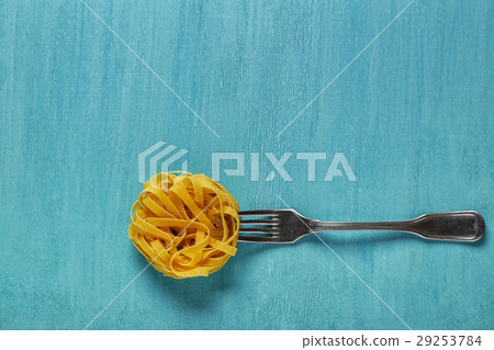 Concept of food, pasta on a blue background Concept of food, pasta on a blue background 29253784