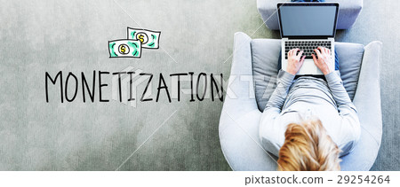 Monetization text with man using a laptop 29254264