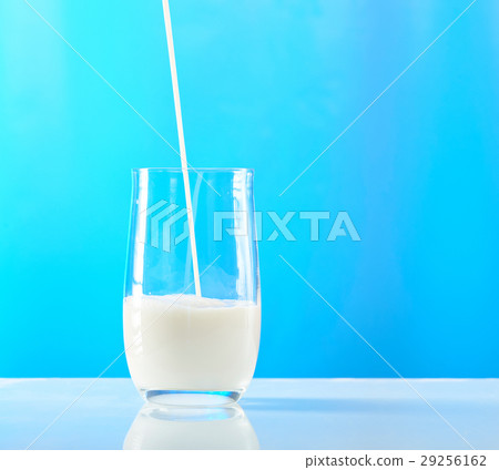 pouring milk in glass pouring milk in glass 29256162
