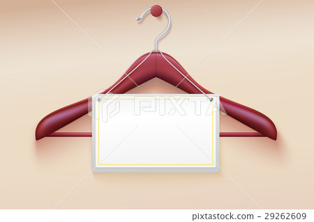 Wooden hanger with tag isolated on cream Wooden hanger with tag isolated on cream 29262609