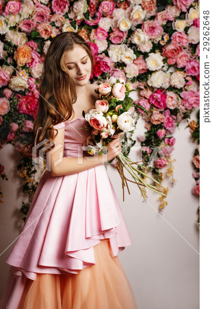 Young beautiful girl at the flower interior 29262648