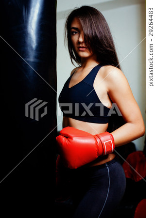 sexy fighter girl in gym with boxing bag 29264483