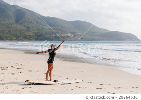 surfing woman with surfing board on the beach surfing woman with surfing board on the beach 29264536