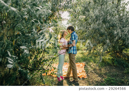 teenage couple kissing in park teenage couple kissing in park 29264566