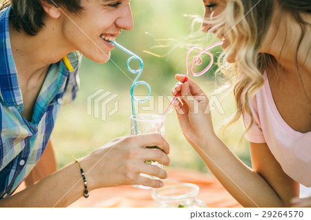 teenage couple smiling with cocktail teenage couple smiling with cocktail 29264570