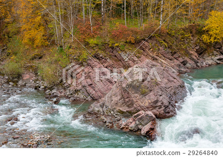 Rock in stream flow of mountains river fall season Rock in stream flow of mountains river fall season 29264840