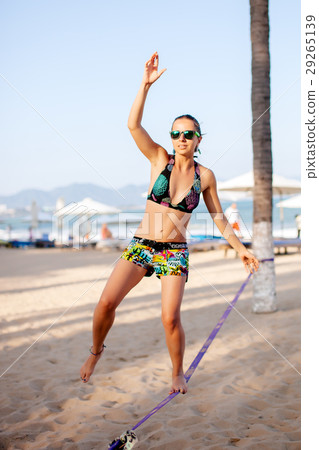 teenage girl balancing on slackline teenage girl balancing on slackline 29265139