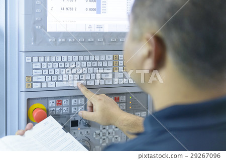 The CNC panel with the operator The CNC panel with the operator 29267096