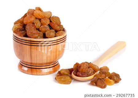 raisins in a wooden bowl with spoon isolated on raisins in a wooden bowl with spoon isolated on 29267735