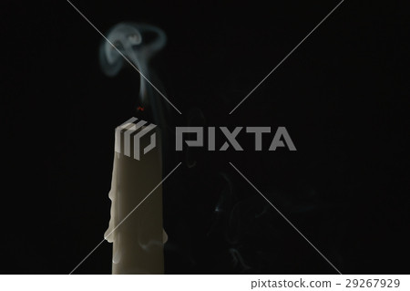 tall candle with smoke trail over black background tall candle with smoke trail over black background 29267929