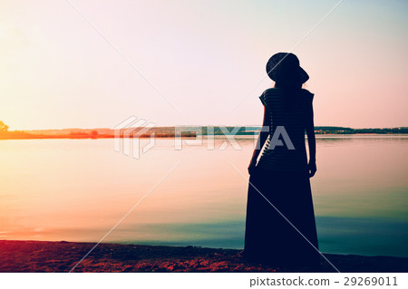 silhouette woman standing alone at sea coast silhouette woman standing alone at sea coast 29269011