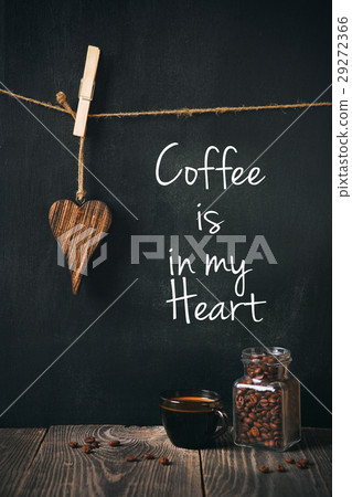 cup of coffee with beans and written phrase 29272366