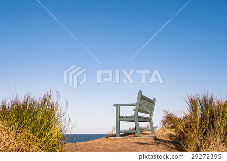 A bench on shore of the Baltic Sea 29272395