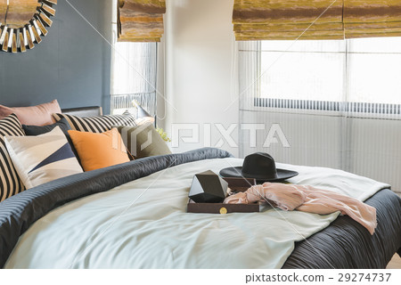 set of pillows on bed with blanket 29274737