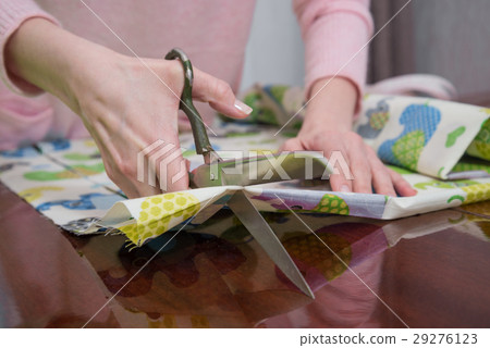 Tailor designer working of cutting piece of cloth Tailor designer working of cutting piece of cloth 29276123