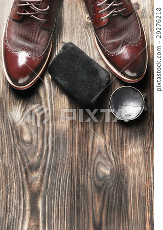 leather shoes on table with polishing equipment 29276218