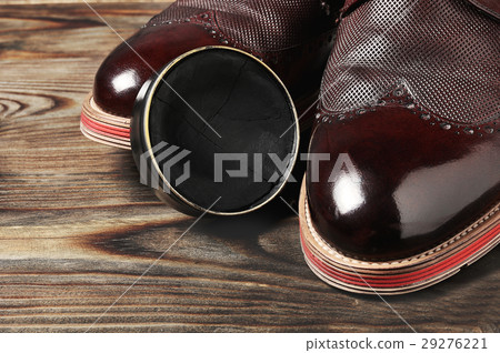 leather shoes on table with polishing equipment 29276221