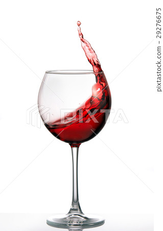 Glass with a splash of red wine isolated on white 29276675