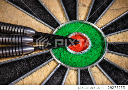 three darts lying on dartboard, close up three darts lying on dartboard, close up 29277255