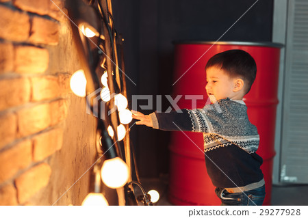 little boy plays with light bulbs little boy plays with light bulbs 29277928