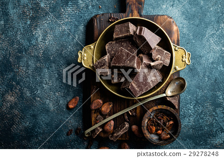 Dark chocolate pieces crushed and cocoa beans 29278248