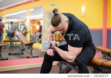 Closeup of a bodybuilder working out 29280237