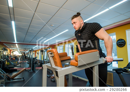 Focused man doing dips in the gym Focused man doing dips in the gym 29280266