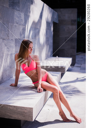 woman sit on concrete near swimming pool at resort woman sit on concrete near swimming pool at resort 29280268
