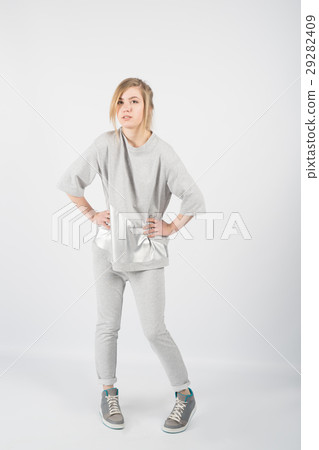 beautiful girl wearing grey clothes and sneakers 29282409