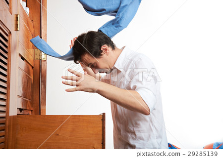 man throw blue pants 29285139