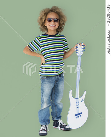 Portrait of a Little African Descent Boy with a Guitar Isolated Portrait of a Little African Descent Boy with a Guitar Isolated 29290439