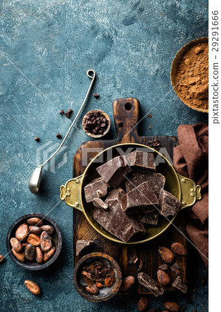 Dark chocolate pieces crushed and cocoa beans Dark chocolate pieces crushed and cocoa beans 29291666