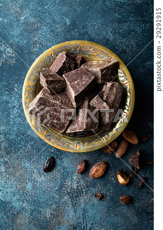 Dark chocolate pieces crushed and cocoa beans Dark chocolate pieces crushed and cocoa beans 29291915