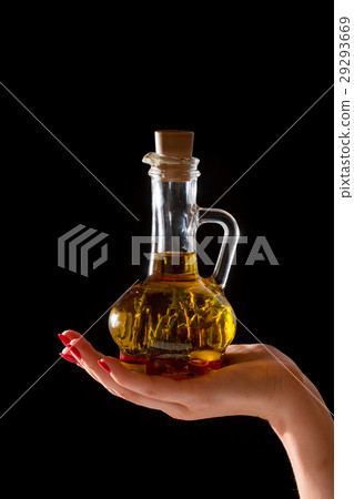 Bottle of olive oil with fresh herbs 29293669