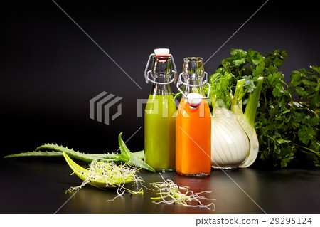 Glasses with fresh vegetable juices on black. Glasses with fresh vegetable juices on black. 29295124