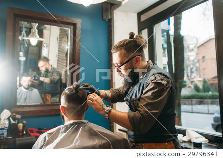 Senior barber finishing stylish hairdo free space Senior barber finishing stylish hairdo free space 29296341